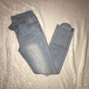 Light wash distressed denim jeans